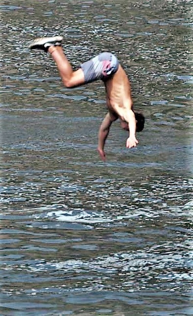 cliff-jumping into river